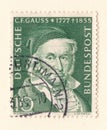 An old green german stamp with an image of Johann Carl Friedrich Gauss the mathematician and physicist