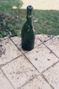 Old green glass bottle located in an old house Royalty Free Stock Photo