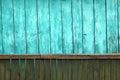 Old green grunge wooden fence and cyan wooden wall pattern