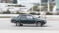 Old green Lada 21099 in motion. Speeding in city road concept. Obsolete model of VAZ is driving in the City of Moscow