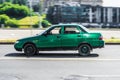 Old green Lada 2110 in motion. Speeding in city road concept. Obsolete model of VAZ is driving in the City of Moscow