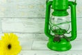 Old green lantern with colorful flowers Royalty Free Stock Photo