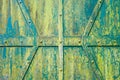 Old green metal gate with rivets. Royalty Free Stock Photo