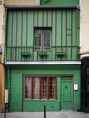 Old green and red building in Paris, France Royalty Free Stock Photo