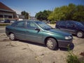 Old green Renault Laguna 2,2 first model parked right side view