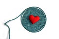 Old green rope and red heart isolate on white background Royalty Free Stock Photo