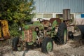 Old green rusty damaged truck parked in front of a garage Royalty Free Stock Photo