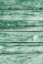 Old green shabby wooden planks with cracked color paint Royalty Free Stock Photo