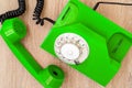 Old green telephone on wooden table, top view Royalty Free Stock Photo