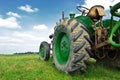 Old green tractor in the field Royalty Free Stock Photo