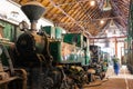 Old green train under renovation in an industrial site Royalty Free Stock Photo