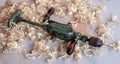 Used, very old, rusty hand drill for carpentry stays on the workbench in light wood chips Royalty Free Stock Photo