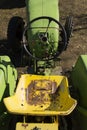 Old green vintage tractor stands on farm yard Royalty Free Stock Photo