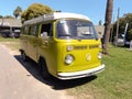 old green Volkswagen Type 2 T2 Kombi minibus Wolfsburg Edition van on the grass. Classic car show