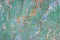 Old green, white and blue painted metal sheet with traces of corrosion and rust Royalty Free Stock Photo