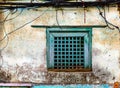 Old green window and grungy wall