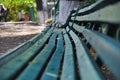 an old green wooden bench stands in the autumn park