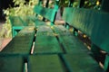 an old green wooden bench stands in the autumn park Royalty Free Stock Photo