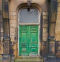 Old green double door in wooden frame Royalty Free Stock Photo