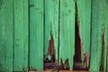 Old green wooden wall with a hole. Royalty Free Stock Photo