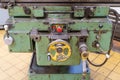 Old green worn milling machine control buttons and control dials in a workshop Royalty Free Stock Photo