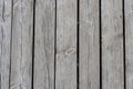 Old grey barn wood background texture with scratches and cracks close up Royalty Free Stock Photo