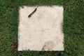 Concrete block on green grass background Royalty Free Stock Photo