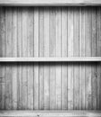 Old grey empty book sheves on wooden wall Royalty Free Stock Photo
