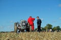 Old grey Ferguson tractor and red suited driver Royalty Free Stock Photo