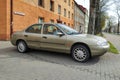 Old grey Ford Mondeo sedan car first model parked