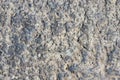 Old grey rough stone wall closeup texture background, selective focus, shallow DOF Royalty Free Stock Photo