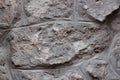 Old grey stone wall background texture close up. Krakow, Poland Royalty Free Stock Photo