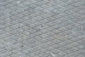 Old grey weathered concrete plate, rough grunge abstract cement tile texture diagonal groove pattern macro closeup, diagonally