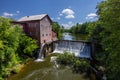 Old Grist Mill with Water Wheel and Dam Royalty Free Stock Photo