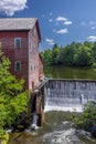 Old Grist Mill with Water Wheel and Dam Royalty Free Stock Photo