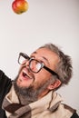 Old grumpy man with beard and big nerd glasses Royalty Free Stock Photo