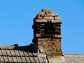old grunge damaged broken brick smoke stack or chimney with loose and spalling bricks Royalty Free Stock Photo