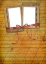 Old grunge frame with ribbons and bow Royalty Free Stock Photo