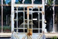 Old grunge glass greenhouse. rusty steel frame with white paint Royalty Free Stock Photo