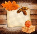 Old grunge paper with autumn oak leaves and Gift box Royalty Free Stock Photo