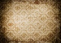 Old grunge paper background with floral pattern.