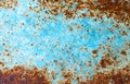 Old grunge vintage background: rusty metal surface with blue paint flaking Royalty Free Stock Photo