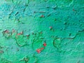 Old grunge vintage background: rusty metal surface with green red paint flaking and cracking texture Royalty Free Stock Photo