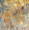 Grunge wall of an old house with remainings of color