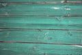 Old, grunge wood panels painted into teal green used as background Royalty Free Stock Photo