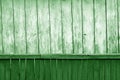 Old grunge wooden fence and wooden wall pattern in green tone Royalty Free Stock Photo