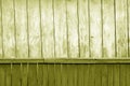 Old grunge wooden fence and wooden wall pattern in yellow tone Royalty Free Stock Photo