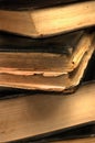 Old grungy books closeup in sepia shallow DOF