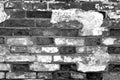 Old grungy brick wall surface in black and white Royalty Free Stock Photo