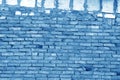 Old grungy brick wall surface in navy blue tone. Royalty Free Stock Photo